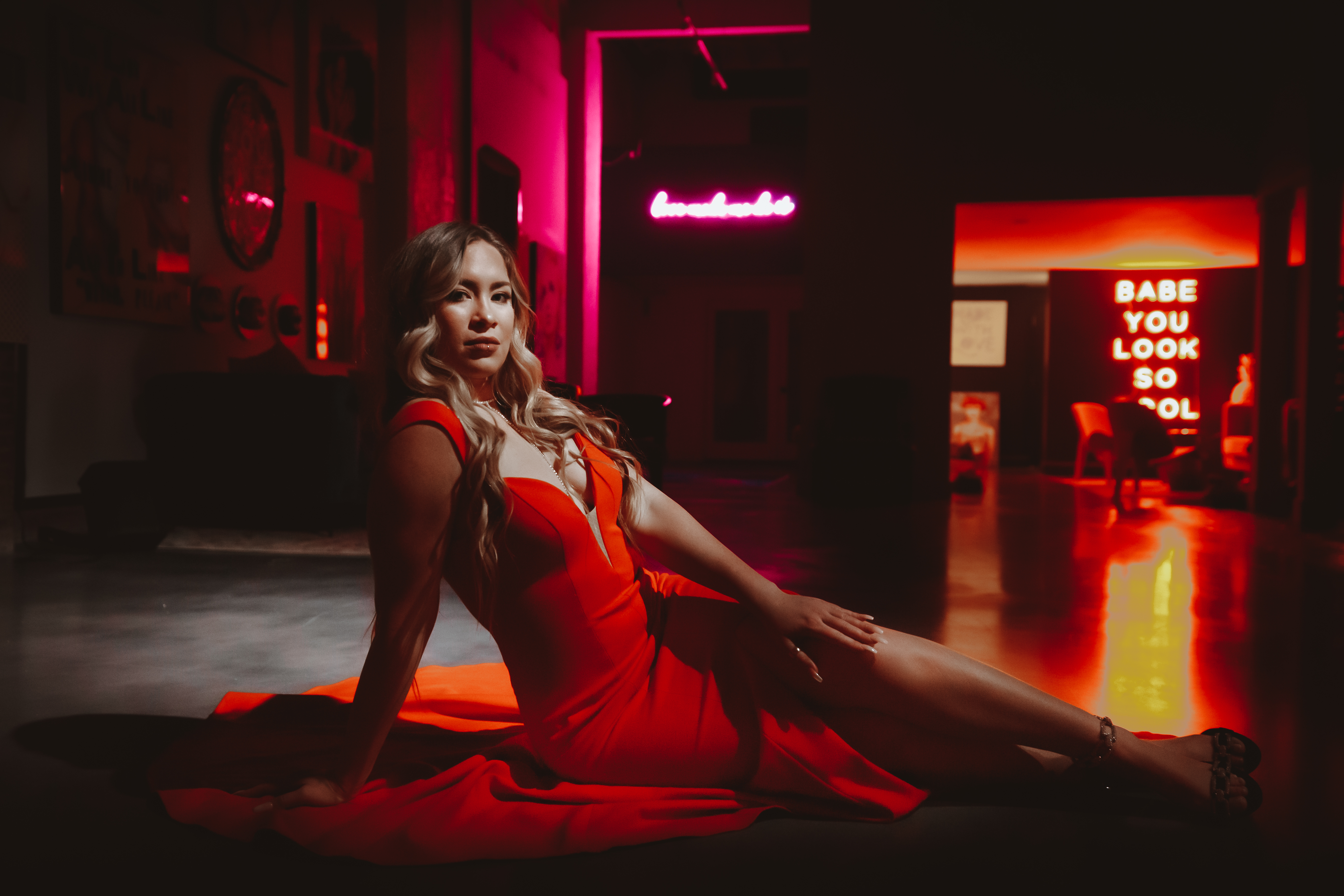 Dreya in a horizontal red-gown promotional portrait